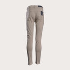 A pair of slim-fit, straight-leg pants in a light taupe-beige color, shown against a solid off-white background. 7 For All Mankind Slimmy Sateen Jeans. Sakks Menswear Southampton.