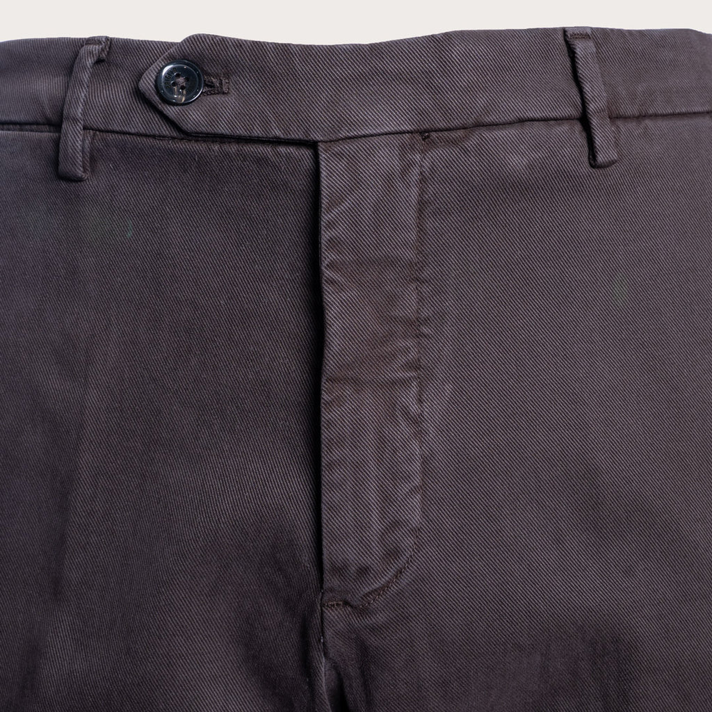 Close-up of dark charcoal gray trousers showing the waistband, button, belt loops, and front fly area. Briglia 1949 Trousers available at Sakks Menswear in Southampton.
