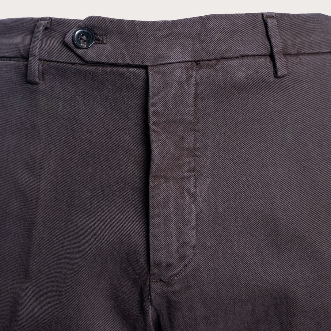Close-up of dark charcoal gray trousers showing the waistband, button, belt loops, and front fly area. Briglia 1949 Trousers available at Sakks Menswear in Southampton.