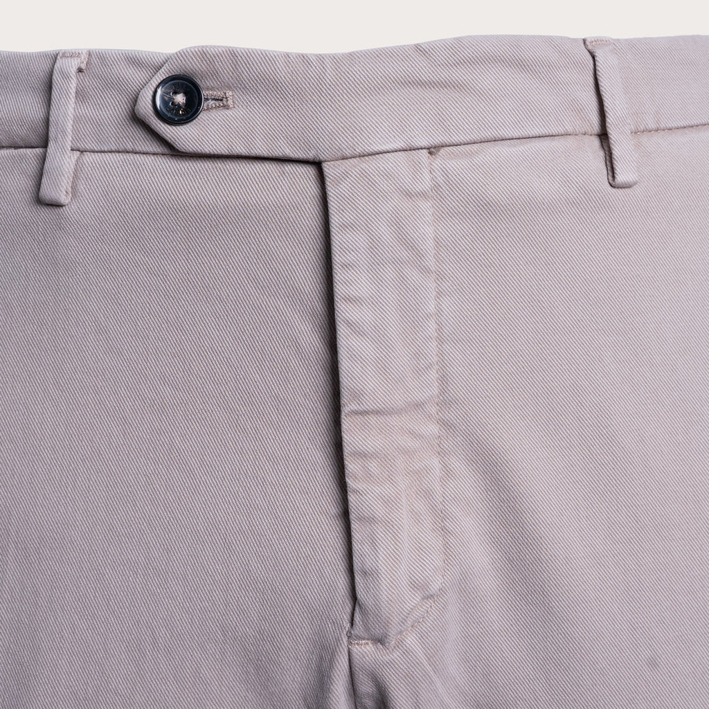 Close-up of the waistband of light gray trousers, showing the button closure, belt loops, and front seam. Briglia 1949 Trousers available at Sakks Menswear in Southampton.