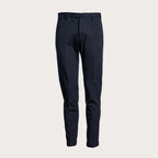 A pair of dark navy blue slim-fit trousers shown from the front against a light beige background. Briglia 1949 Trousers available at Sakks Menswear in Southampton.