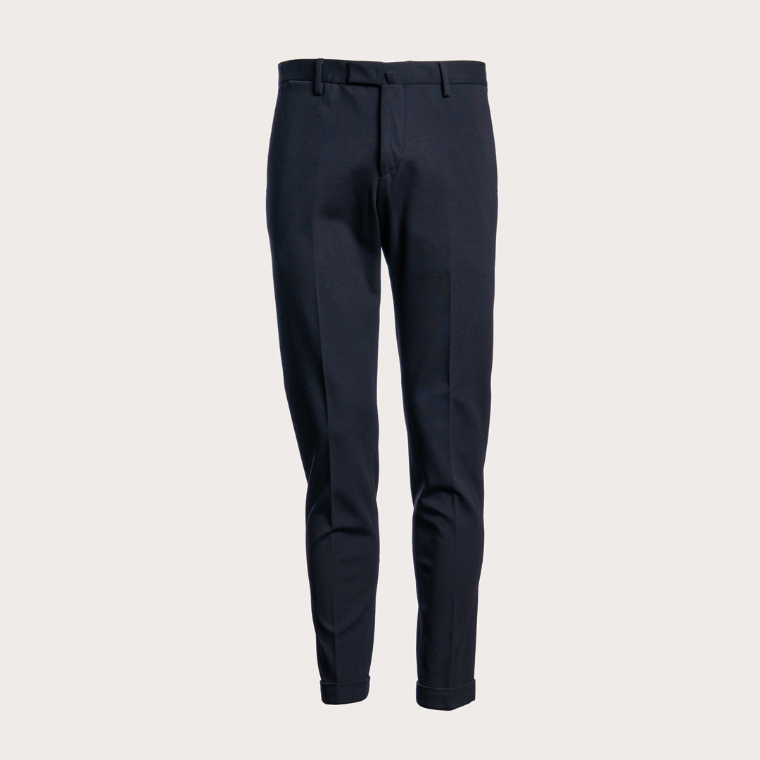 A pair of dark navy blue slim-fit trousers shown from the front against a light beige background. Briglia 1949 Trousers available at Sakks Menswear in Southampton.