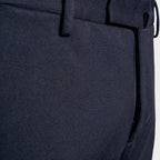 Close-up of dark navy trousers showing the fabric texture, belt loops, and a zippered pocket detail. Briglia 1949 Trousers available at Sakks Menswear in Southampton.