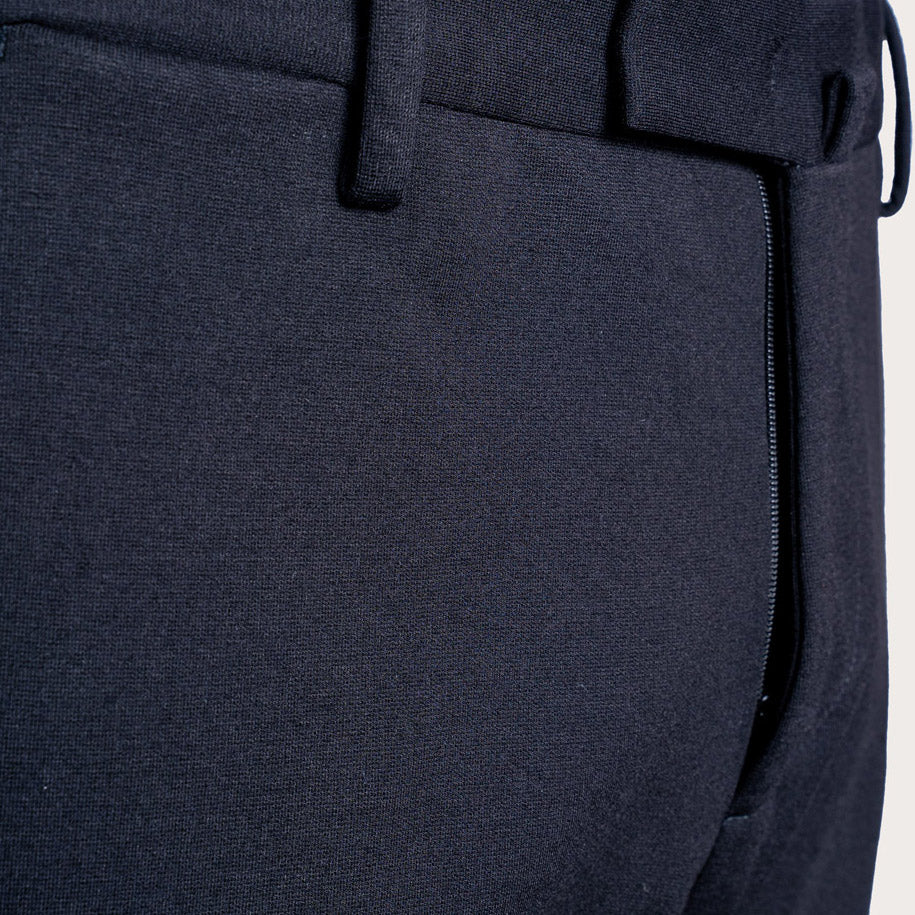 Close-up of dark navy trousers showing the fabric texture, belt loops, and a zippered pocket detail. Briglia 1949 Trousers available at Sakks Menswear in Southampton.