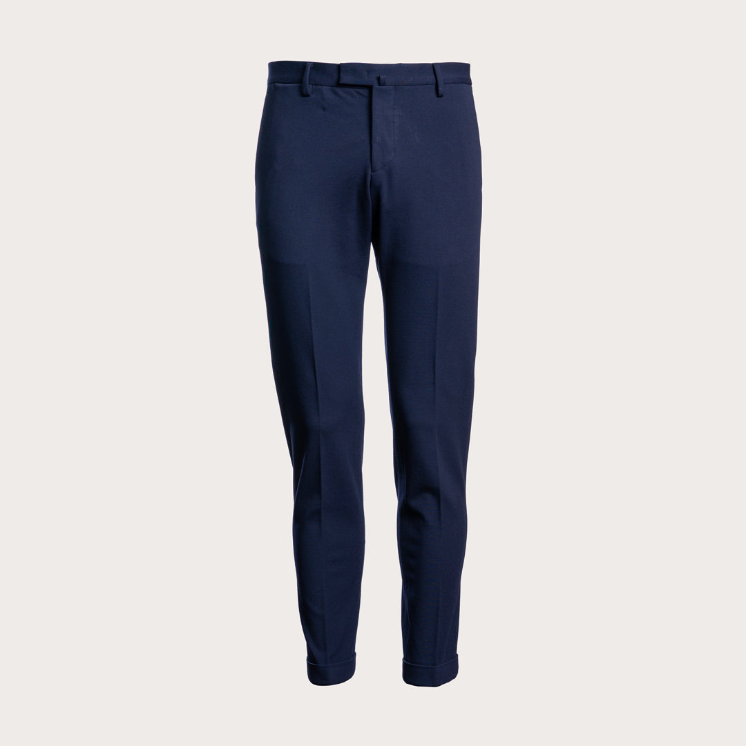 A pair of navy blue slim-fit trousers shown on a clean, solid, light off-white background. Briglia 1949 Trousers available at Sakks Menswear in Southampton.