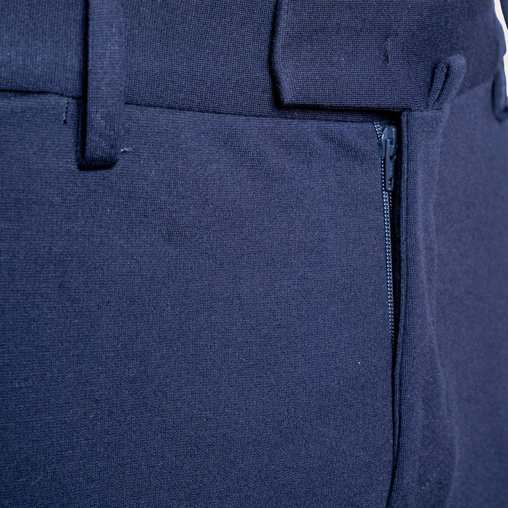 Close-up of dark navy blue trousers showing the fabric texture, belt loops, and a zippered pocket detail. Briglia 1949 Trousers available at Sakks Menswear in Southampton.