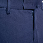 Close-up of dark navy blue trousers showing the fabric texture, belt loops, and a zippered pocket detail. Briglia 1949 Trousers available at Sakks Menswear in Southampton.