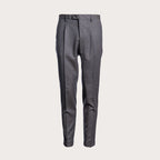 A pair of dark gray, slim-fit trousers with front pleats, shown against a solid light beige background. Briglia 1949 Trousers available at Sakks Menswear in Southampton.