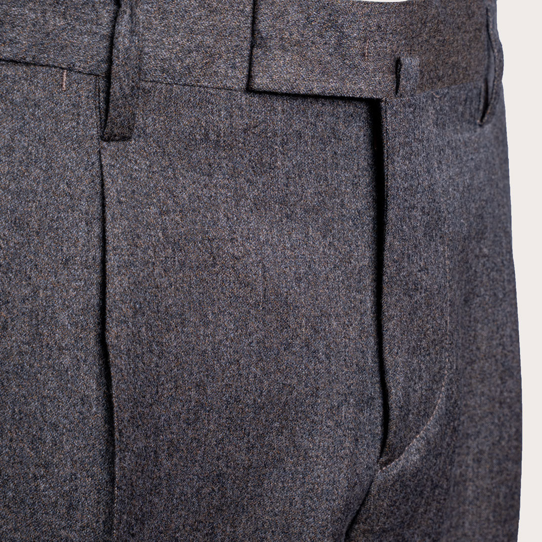 Close-up of dark gray textured wool trousers showing the fabric weave, belt loops, and front crease. Briglia 1949 Trousers available at Sakks Menswear in Southampton.