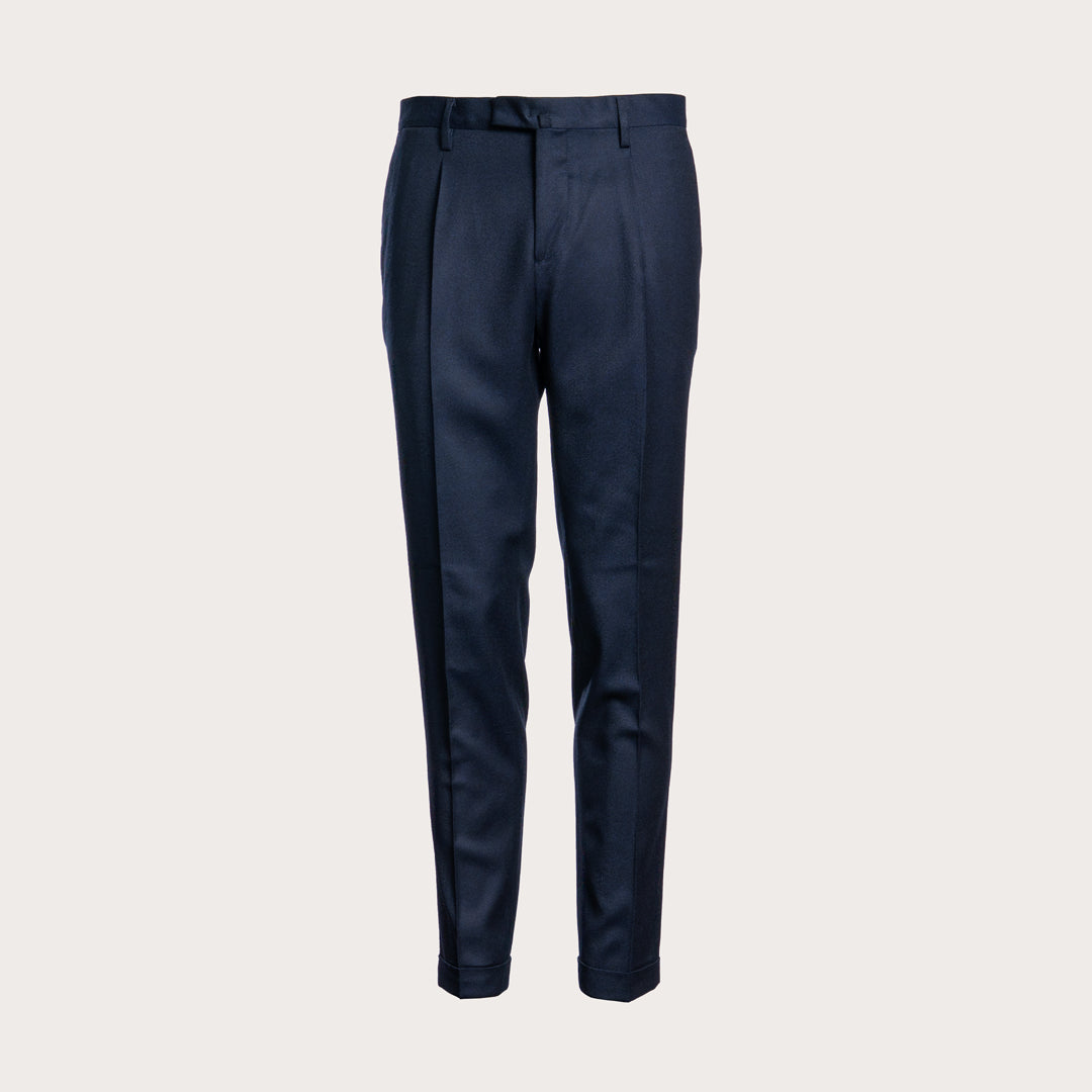 A pair of dark navy blue trousers with a clean, straight-leg fit and subtle front pleats, shown against a solid light gray background. Briglia 1949 Trousers available at Sakks Menswear in Southampton.