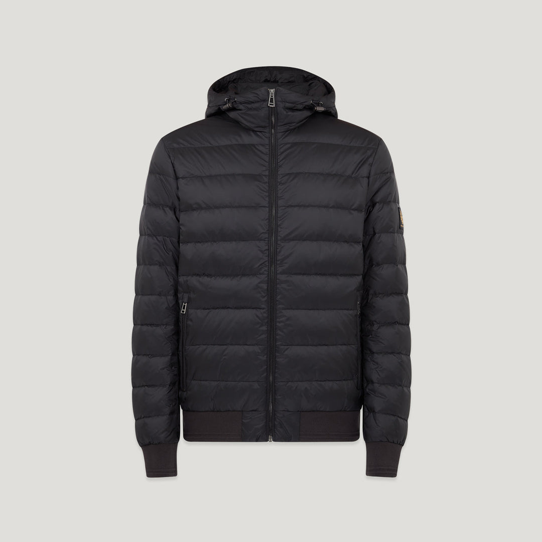 A black hooded puffer jacket with horizontal quilting, a full front zipper, ribbed cuffs and hem, and a small tan brand patch on the left sleeve, shown against a light grey background. Belstaff Down Jacket. Sakks Menswear Southampton.