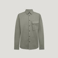 A long-sleeve button-up shirt in a muted sage green color, featuring a single chest pocket and dark buttons, displayed against a solid light gray background. Belstaff Shirt. Sakks Menswear Southampton.