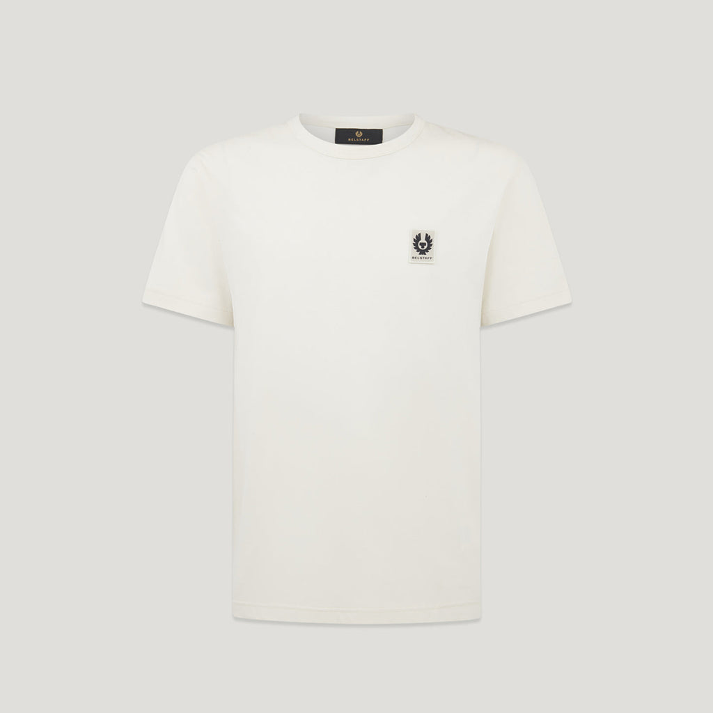 An off-white short-sleeve crewneck t-shirt with a small black embroidered logo on the left chest, displayed on a neutral light gray background. Belstaff T-Shirt. Sakks Menswear Southampton.