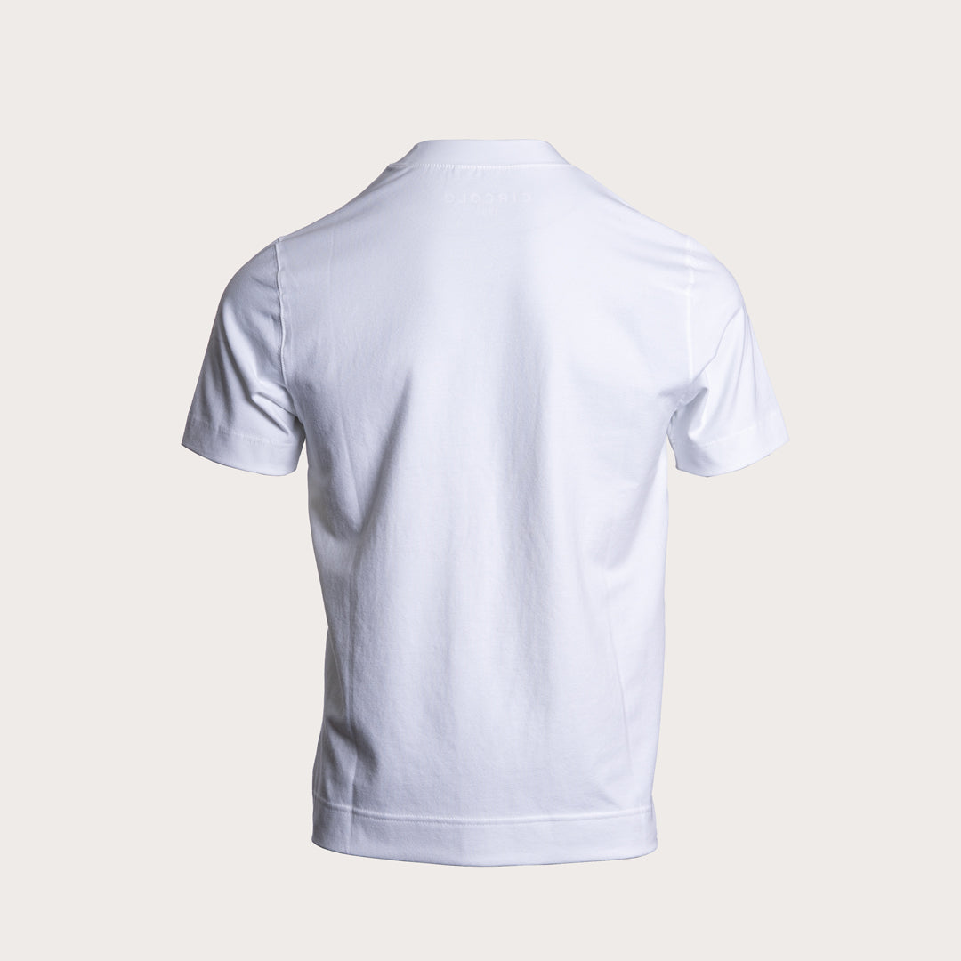 A white short-sleeve crewneck t-shirt shown from the back, displayed on a clean, solid, light beige background. Circolo 1901 T-Shirt available at Sakks Menswear in Southampton.