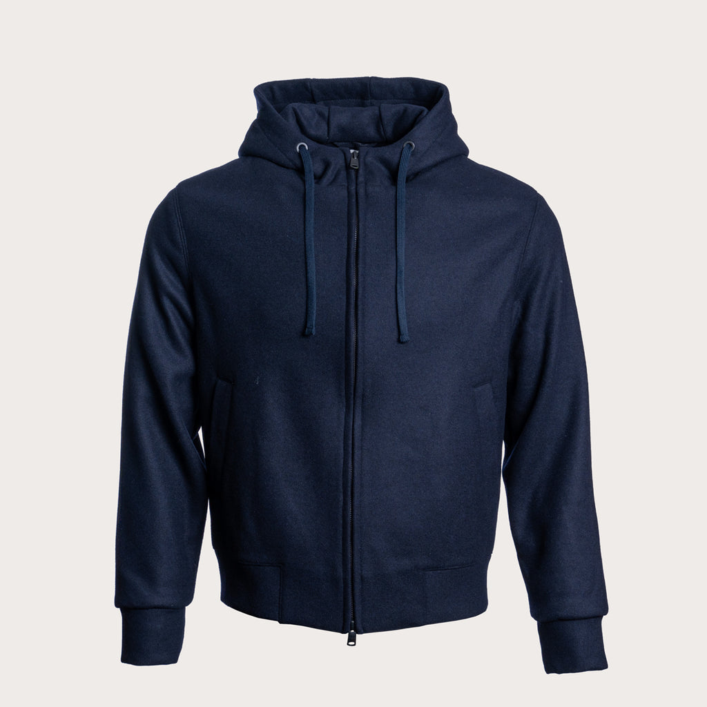 A navy blue zip-up hoodie with a drawstring hood and front pockets, displayed on a neutral light gray background. Circolo 1901 Hoodie available at Sakks Menswear in Southampton.