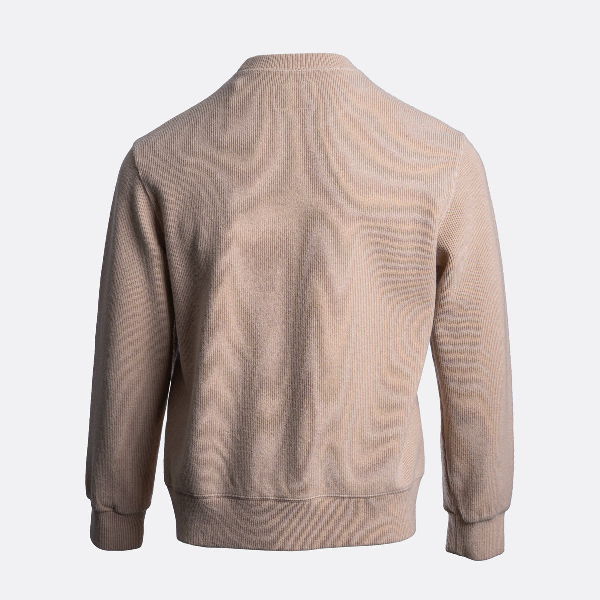 A light beige ribbed knit sweater shown from the back, featuring a crew neck, long sleeves, and ribbed cuffs and hem, set against a plain light gray background. Circolo 1901 Jumper available at Sakks Menswear in Southampton.