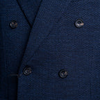 Close-up of a textured navy blue double-breasted suit jacket, showing the fabric weave and dark buttons. Circolo 1901 Blazer available at Sakks Menswear in Southampton.
