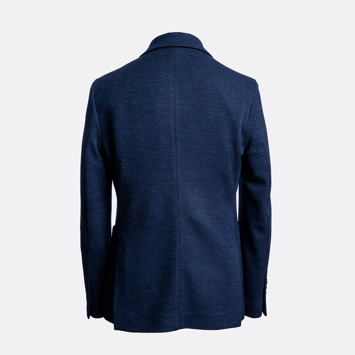 A navy blue textured blazer shown from the back, photographed on a clean, light gray background. Circolo 1901 Blazer available at Sakks Menswear in Southampton.