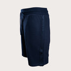 A pair of dark navy blue athletic shorts with a drawstring waistband and a vertical seam detail on the side, shown against a light gray background. Emporio Armani Shorts. Sakks Menswear Southampton.