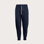 A pair of dark navy blue sweatpants with a white drawstring, shown against a light gray background. Emporio Armani Sweat Pants. Sakks Menswear Southampton.