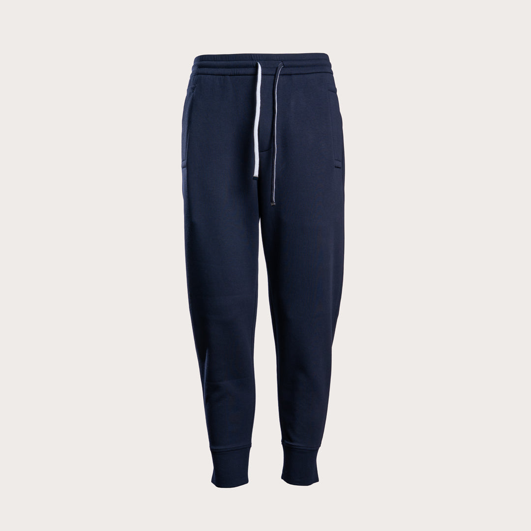 A pair of dark navy blue sweatpants with a white drawstring, shown against a light gray background. Emporio Armani Sweat Pants. Sakks Menswear Southampton.