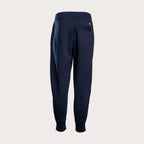 A pair of navy blue sweatpants shown from the back, featuring a relaxed fit, elastic waistband, and a small circular logo on the upper right side, set against a solid light gray background. Emporio Armani Sweat Pants. Sakks Menswear Southampton.