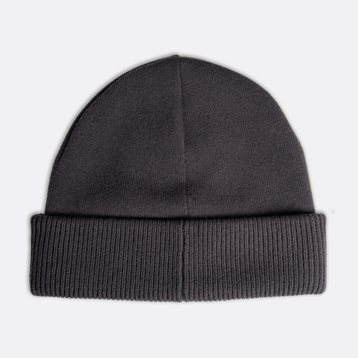 A dark gray ribbed knit beanie hat shown flat against a light gray background. Emporio Armani Beanie. Sakks Menswear Southampton.