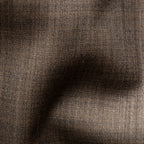 A close-up of a dark brown woven fabric texture with a subtle sheen and fine weave pattern. Eton Shirt available at Sakks Menswear in Southampton.
