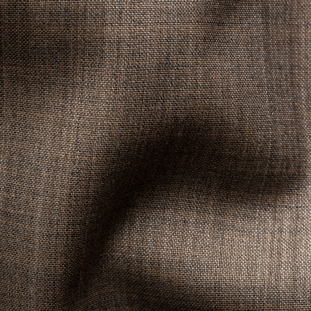 A close-up of a dark brown woven fabric texture with a subtle sheen and fine weave pattern. Eton Shirt available at Sakks Menswear in Southampton.
