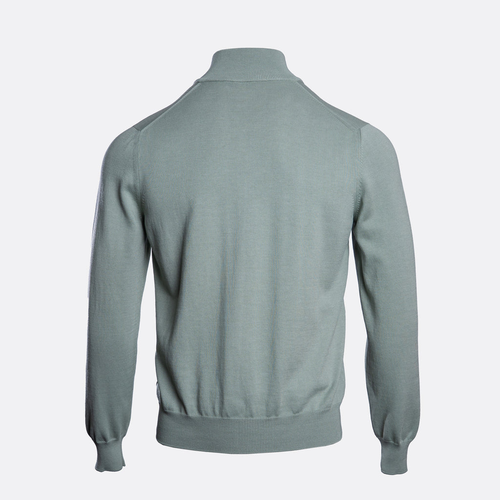 A sage green knit sweater shown from the back, featuring a mock neck, long sleeves, and ribbed cuffs and hem, displayed on a light gray background. Gran Sasso Knitwear available at Sakks Menswear in Southampton.
