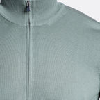 Close-up of a ribbed knit zip-up sweater in a muted sage green color, showing the collar, zipper, and fabric texture. Gran Sasso Knitwear available at Sakks Menswear in Southampton.