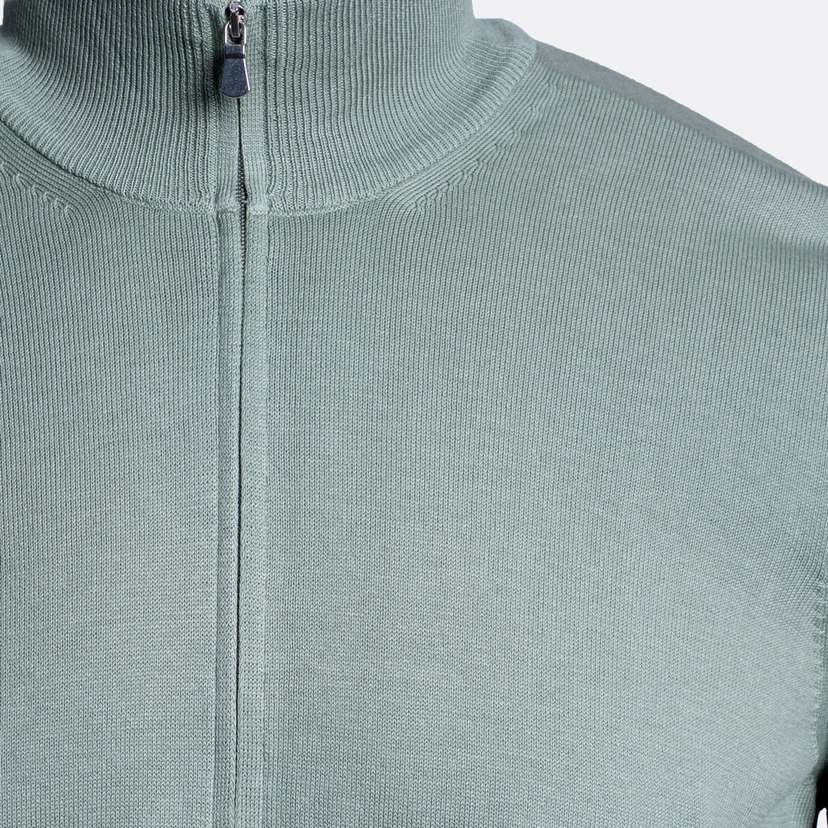 Close-up of a ribbed knit zip-up sweater in a muted sage green color, showing the collar, zipper, and fabric texture. Gran Sasso Knitwear available at Sakks Menswear in Southampton.