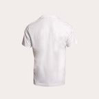 A white short-sleeve crewneck t-shirt shown from the back, displayed on a clean, solid, light beige background. MA.Strum T-Shirt available at Sakks Menswear in Southampton