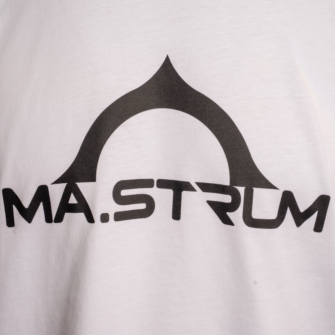 Close-up of a white T-shirt with a large black graphic logo reading 'MA.STRUM' and a stylized arch shape above it. MA.Strum T-Shirt available at Sakks Menswear in Southampton