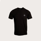 A black short-sleeve crewneck t-shirt with a small white geometric diamond logo on the left chest, displayed on a light gray background. MA.Strum T-Shirt available at Sakks Menswear in Southampton