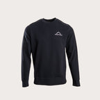 A black long-sleeve crewneck sweatshirt with a small white Kryptek logo on the left chest, displayed on a light gray background. MA.Strum Sweatshirt available at Sakks Menswear in Southampton.