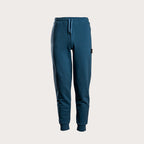 A pair of dark teal blue sweatpants with a drawstring waist and ribbed cuffs, shown against a light beige background. MA.Strum Sweat Pants available at Sakks Menswear in Southampton.