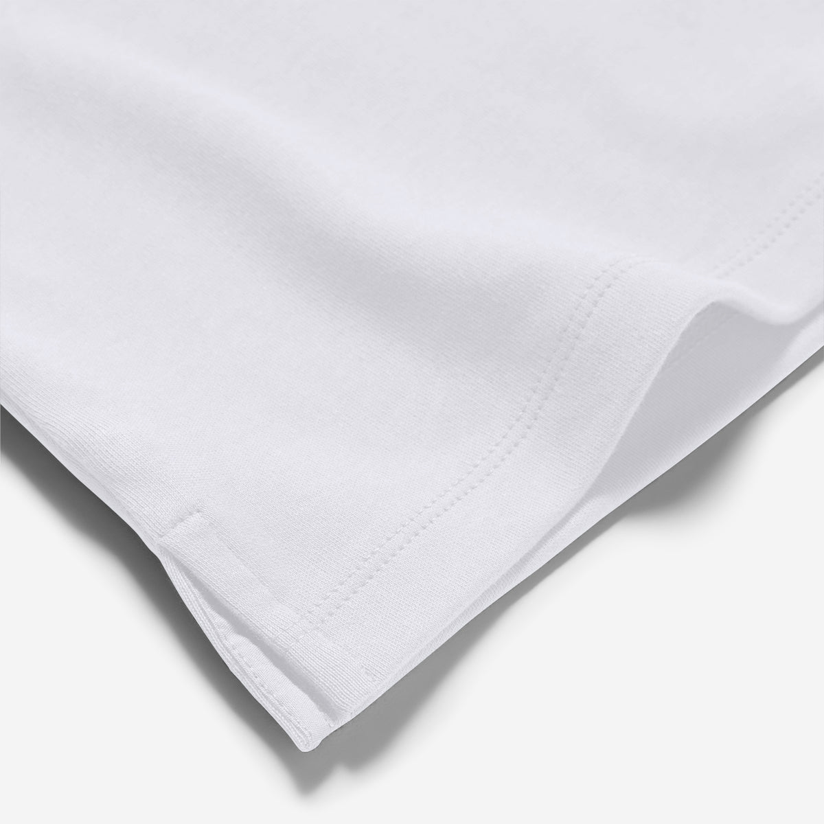 White fabric with a subtle pattern on a light gray background. Oliver Sweeney T-Shirt available at Sakks Menswear in Southampton.