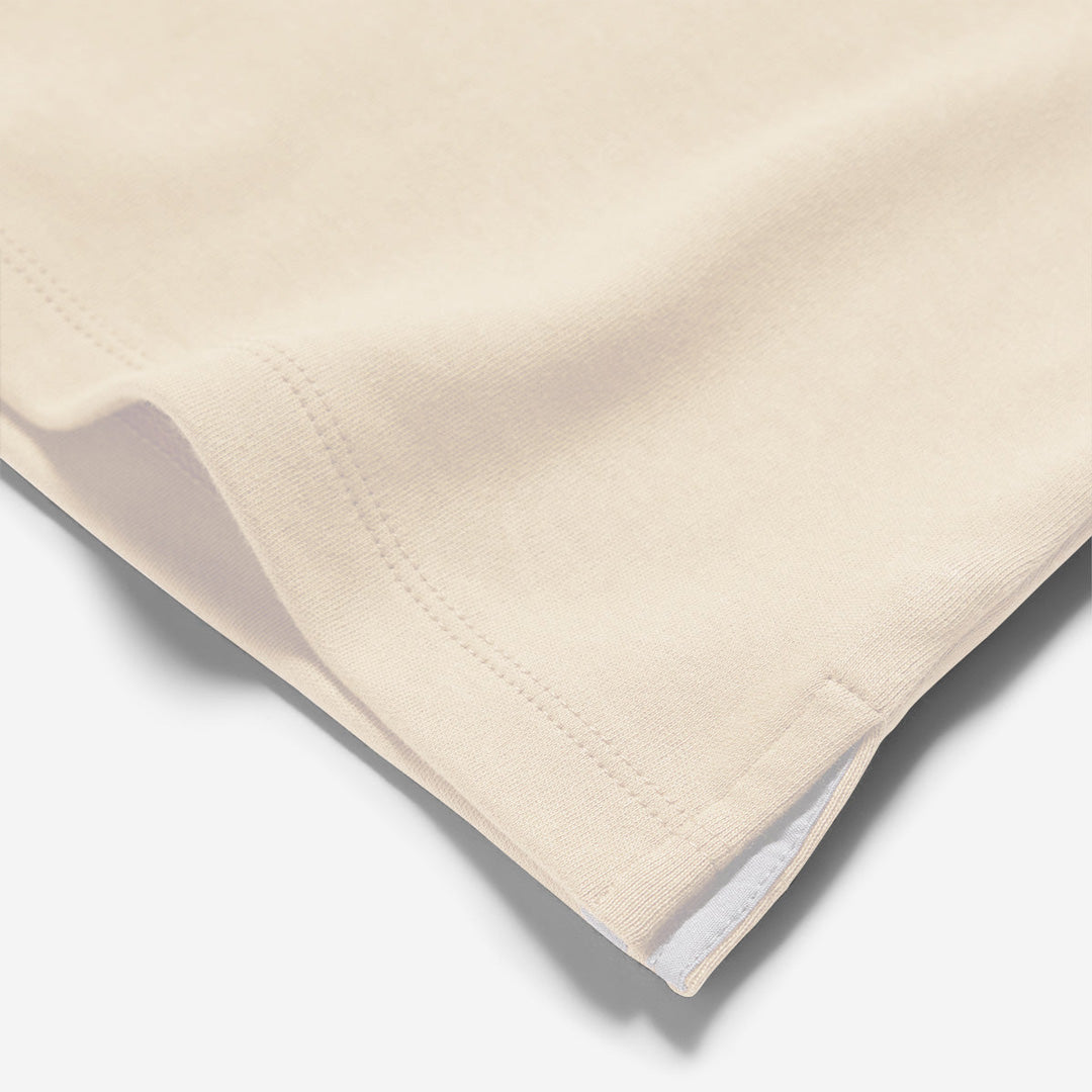 Beige quilted blanket on a white background. Oliver Sweeney T-Shirt available at Sakks Menswear in Southampton