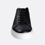 A black leather lace-up sneaker with a textured grain finish, black laces, and a thick white rubber sole, shown from a front-facing perspective on a light gray background. Oliver Sweeney Sneakers available at Sakks Menswear in Southampton.