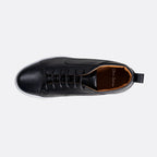 A black pebbled leather lace-up shoe shown from a top-down view against a light gray background. The shoe features a black pull tab on the heel and a visible 'One True Shoes' brand logo on the tan interior lining. Oliver Sweeney Sneakers available at Sakks Menswear in Southampton.