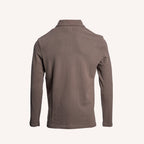 A long-sleeve polo shirt shown from the back, in a solid taupe-brown color, displayed on a clean off-white background. PAIGE Polo available at Sakks Menswear in Southampton.