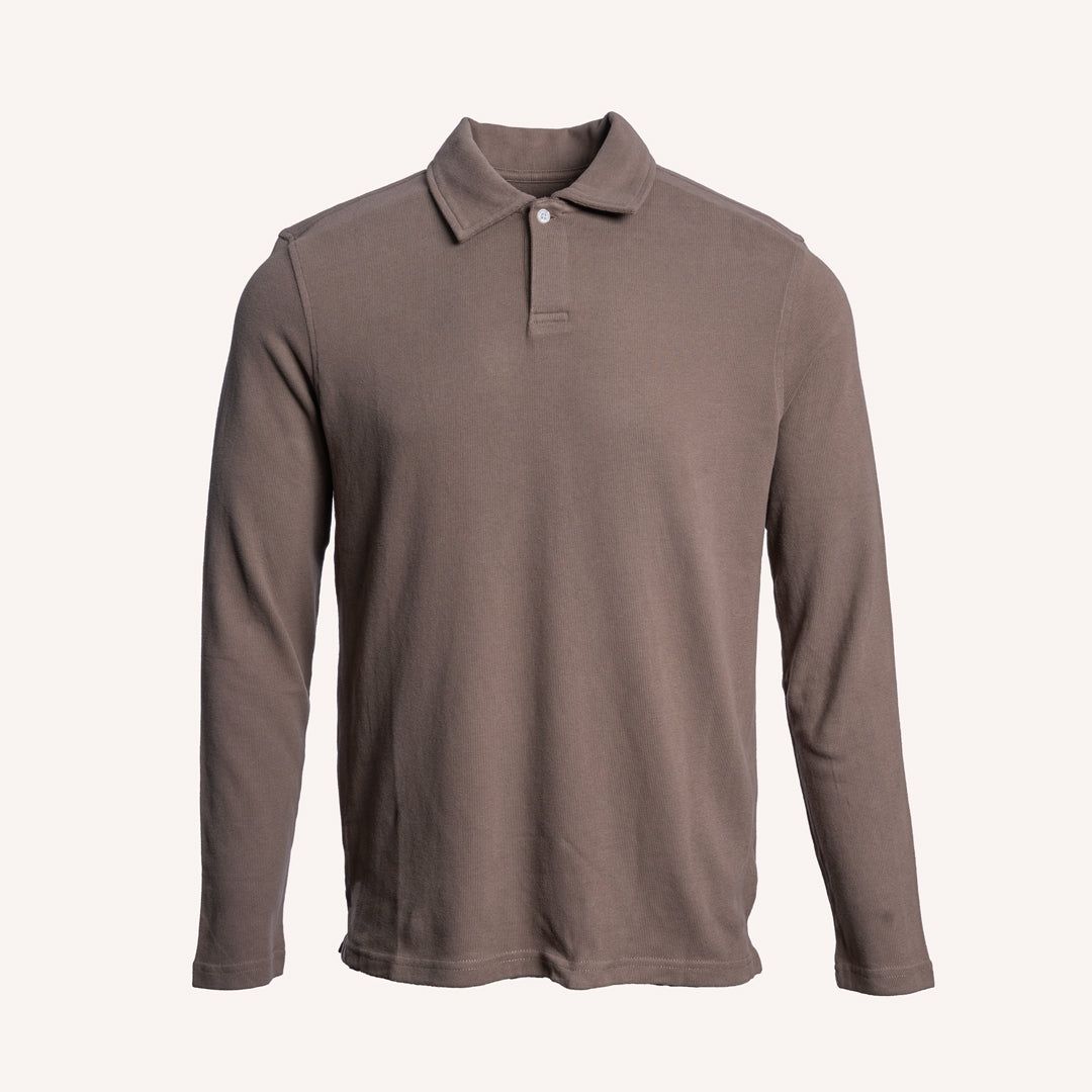 A long-sleeve polo shirt in a solid taupe-brown color, displayed on a clean, off-white background. PAIGE Polo available at Sakks Menswear in Southampton.