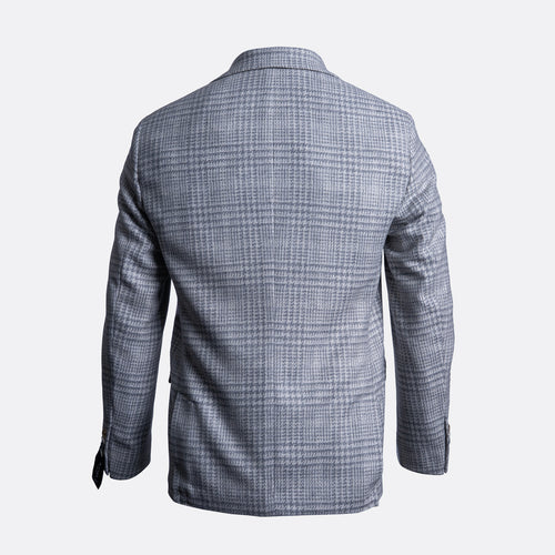 The back view of a men's blazer in a gray and white windowpane plaid pattern, displayed on a clean light gray background. Sand Copenhagen Blazer available at Sakks Menswear in Southampton.