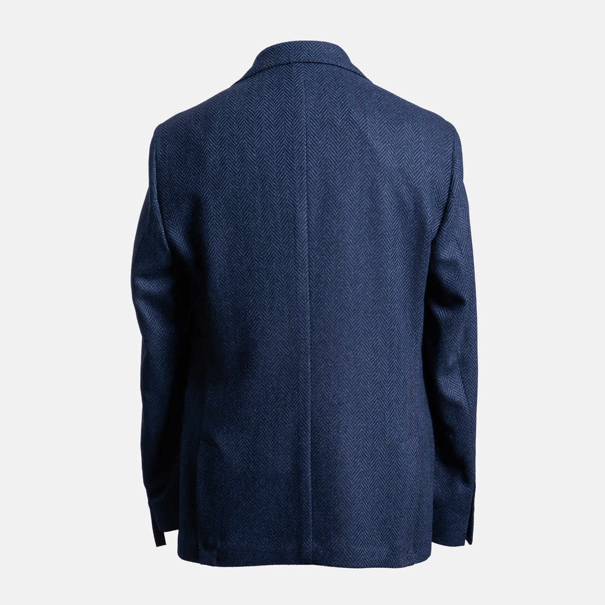 A navy blue textured blazer shown from the back, displayed on a clean, light gray background. Sand Copenhagen Blazer available at Sakks Menswear in Southampton.