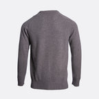 A dark gray knit sweater shown from the back, featuring a crew neck, long sleeves, and ribbed cuffs and hem, set against a plain light gray background. Thomas Maine Jumper available at Sakks Menswear in Southampton.