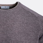 Close-up of a ribbed knit crewneck sweater in a heathered taupe-gray color, showing the inner neck label with the brand name 'Tweedmill'. Thomas Maine Jumper available at Sakks Menswear in Southampton.