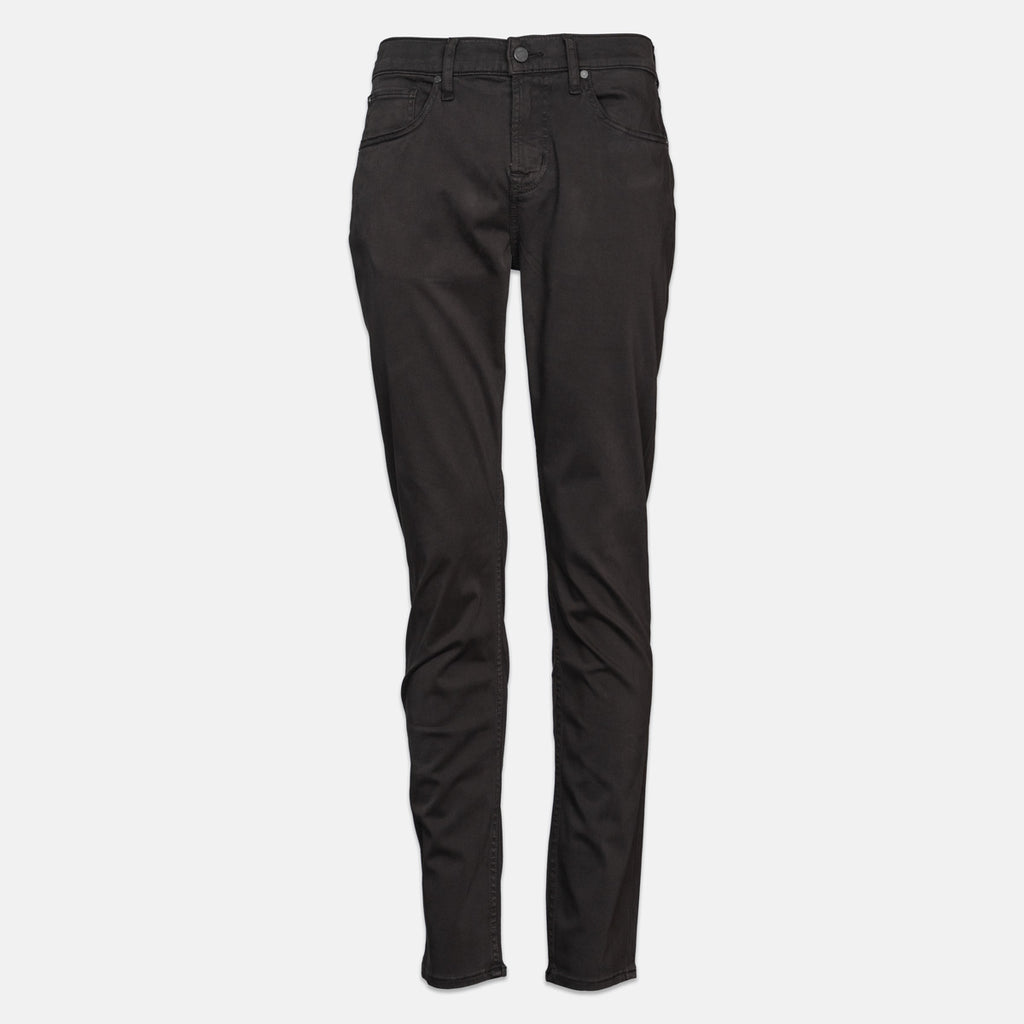 Black slim-fit jeans shown flat against a light gray background. 7 For All Mankind Chinos available at Sakks Menswear in Southampton.