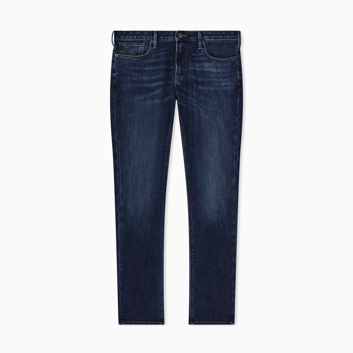 A pair of dark blue slim-fit jeans with subtle whiskering and fading on the thighs, shown flat against a solid white background. Emporio Armani Jeans available at Sakks Menswear in Southampton.