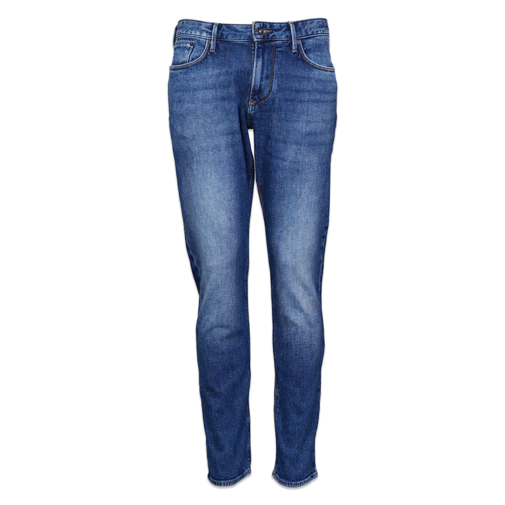 A pair of medium wash blue denim jeans shown flat against a solid white background. Emporio Armani Jeans Available at Sakks Menswear in Southampton.